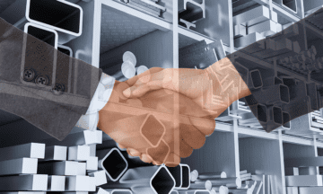 Two people shaking hands representing a partnership