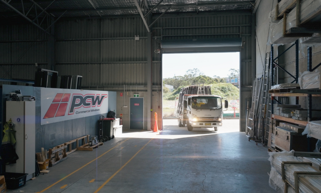 A picture of a PCW truck delivering their windows to customers