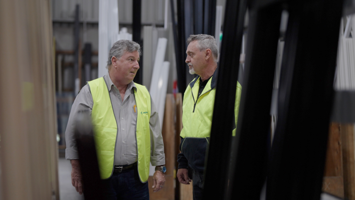 A picture of Capral and Fin Windows disucssing business and showing their strong partnership