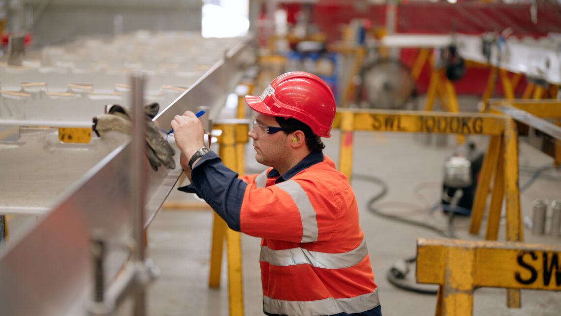 A photo of Austal's employee building the ship