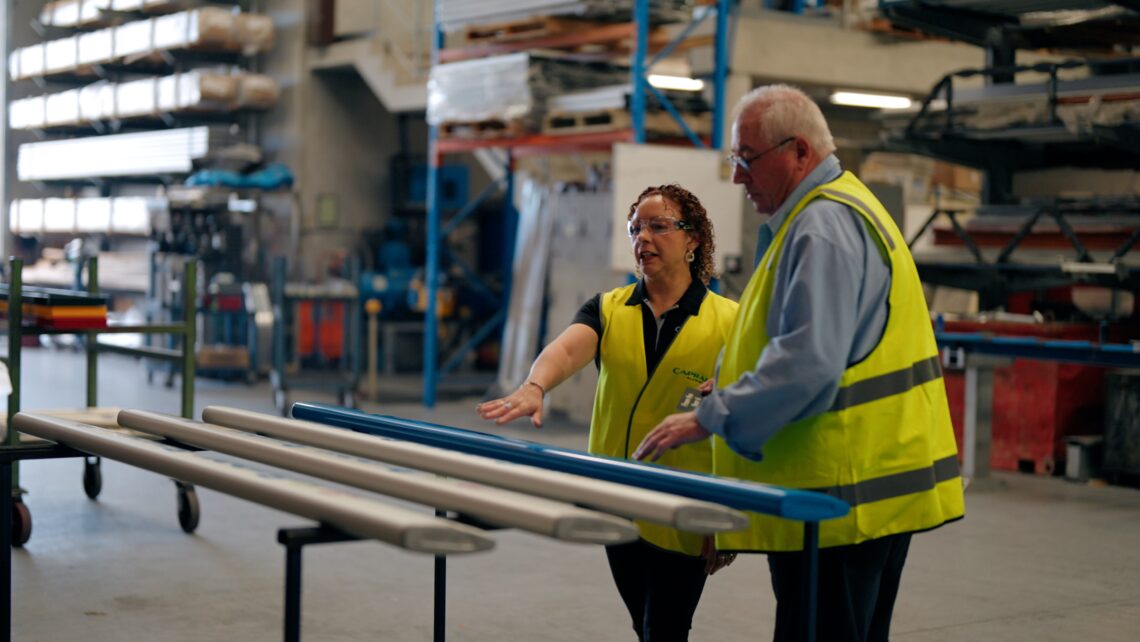 A photo of the founder of BAB showing the range of colours their seats come in