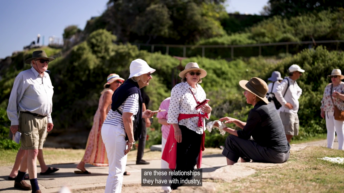 A photo of Lucy Barker's Sculpture being admired by many