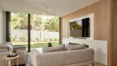 The living room at the residential home the palms collaroy featuring a capral door