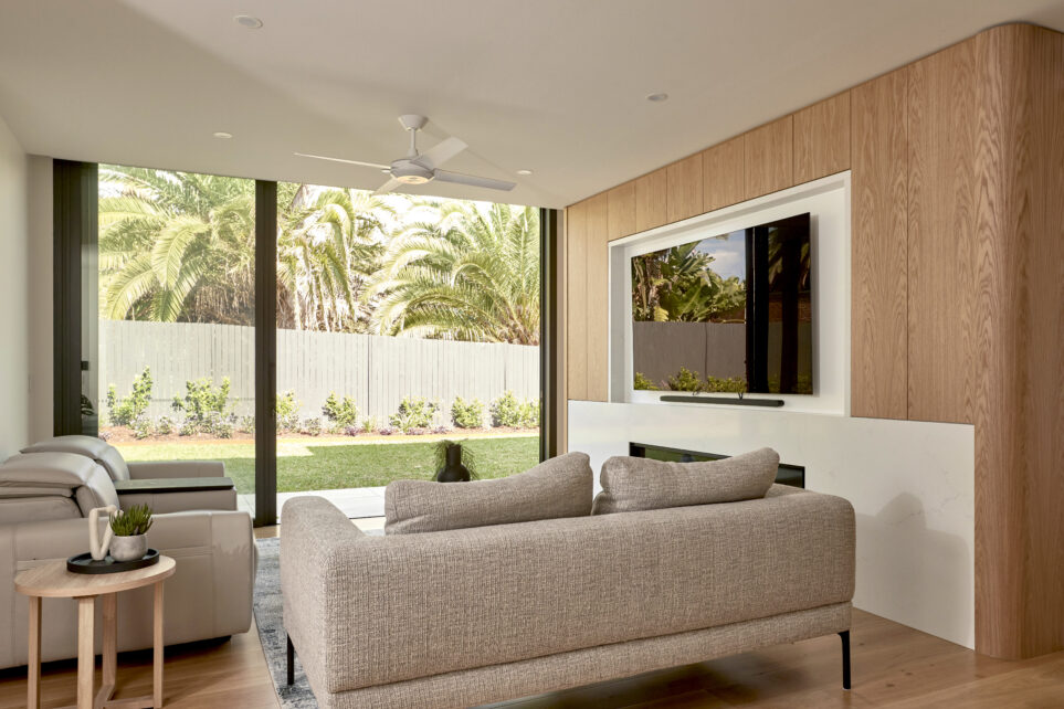 The living room at the residential home the palms collaroy featuring a capral door