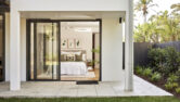 A bedroom at the residential home the palms collaroy featuring a capral door