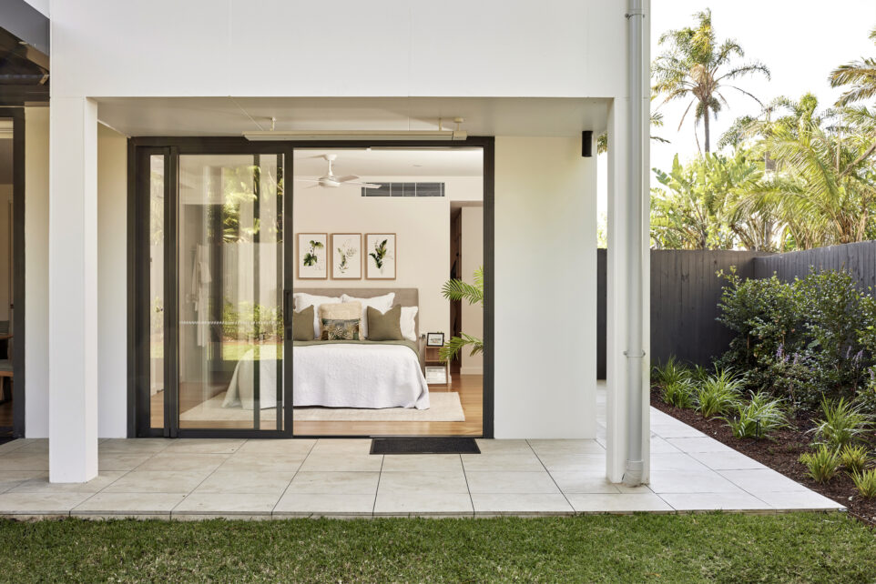 A bedroom at the residential home the palms collaroy featuring a capral door