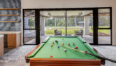 A photo of Monterey Community facility feautring capral window and door system and a pool table