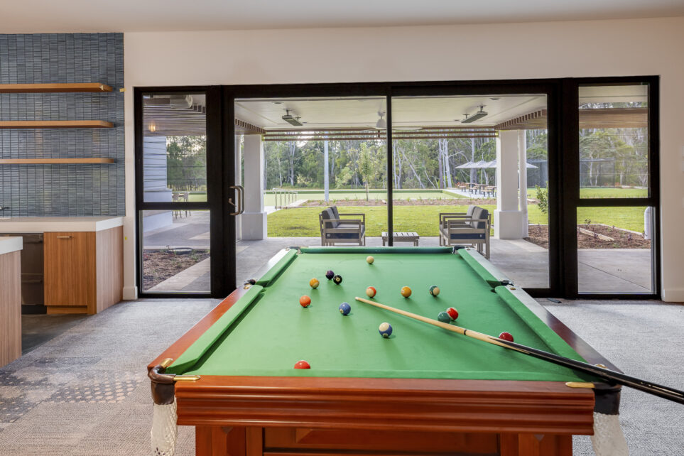 A photo of Monterey Community facility feautring capral window and door system and a pool table