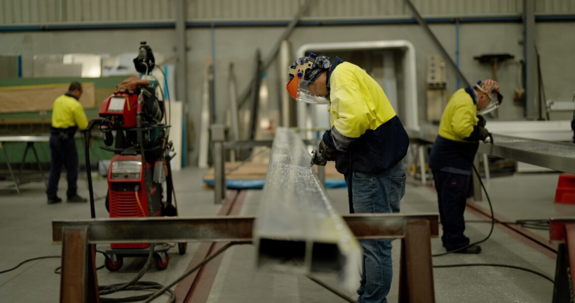 A picture of the team at sloanbuilt working together to build the trailer