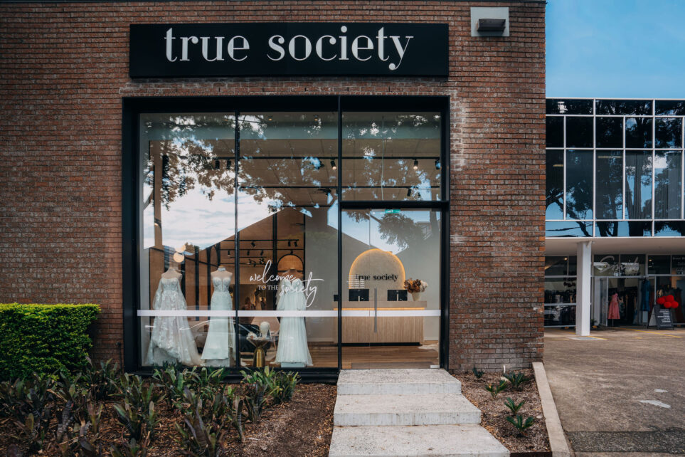 Caprals 419 framing system shown at the front of a boutique with the external hood added