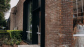Caprals 419 framing system shown at the front of a boutique with the external hood added