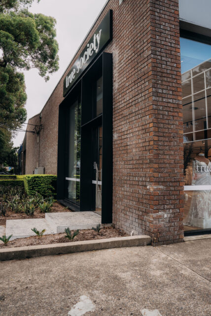 Caprals 419 framing system shown at the front of a boutique with the external hood added